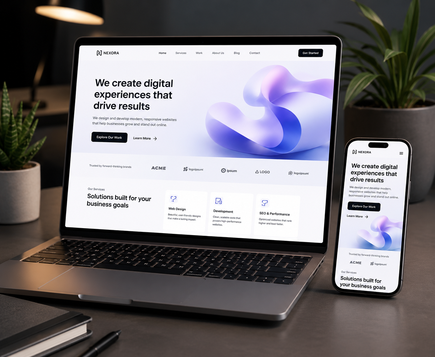 Modern responsive business website displayed on laptop and mobile screens
